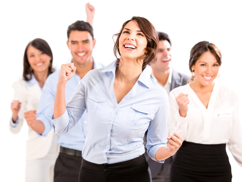 Successful business team celebrating with arms up - isolated over white